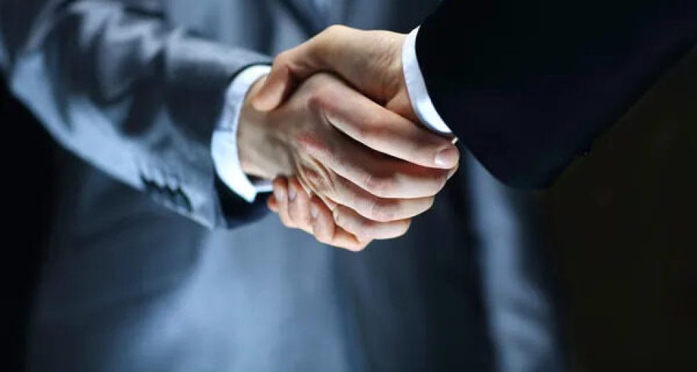 Depositphotos 23185896 stock photo handshake hand holding on black